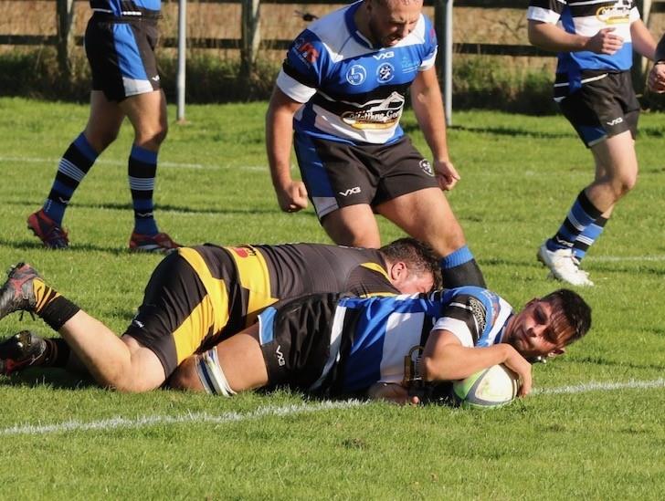 Bryn Thomas powers over for Fishguard - Sion Colella is delighted. Picture Darren Thomas